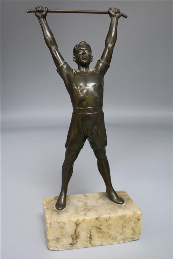 A spelter figure of an athlete